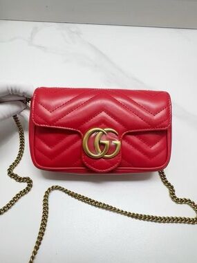 NWOT 100% Auth Gucci supermini marmont leather bag in red w/ gold tone hardware